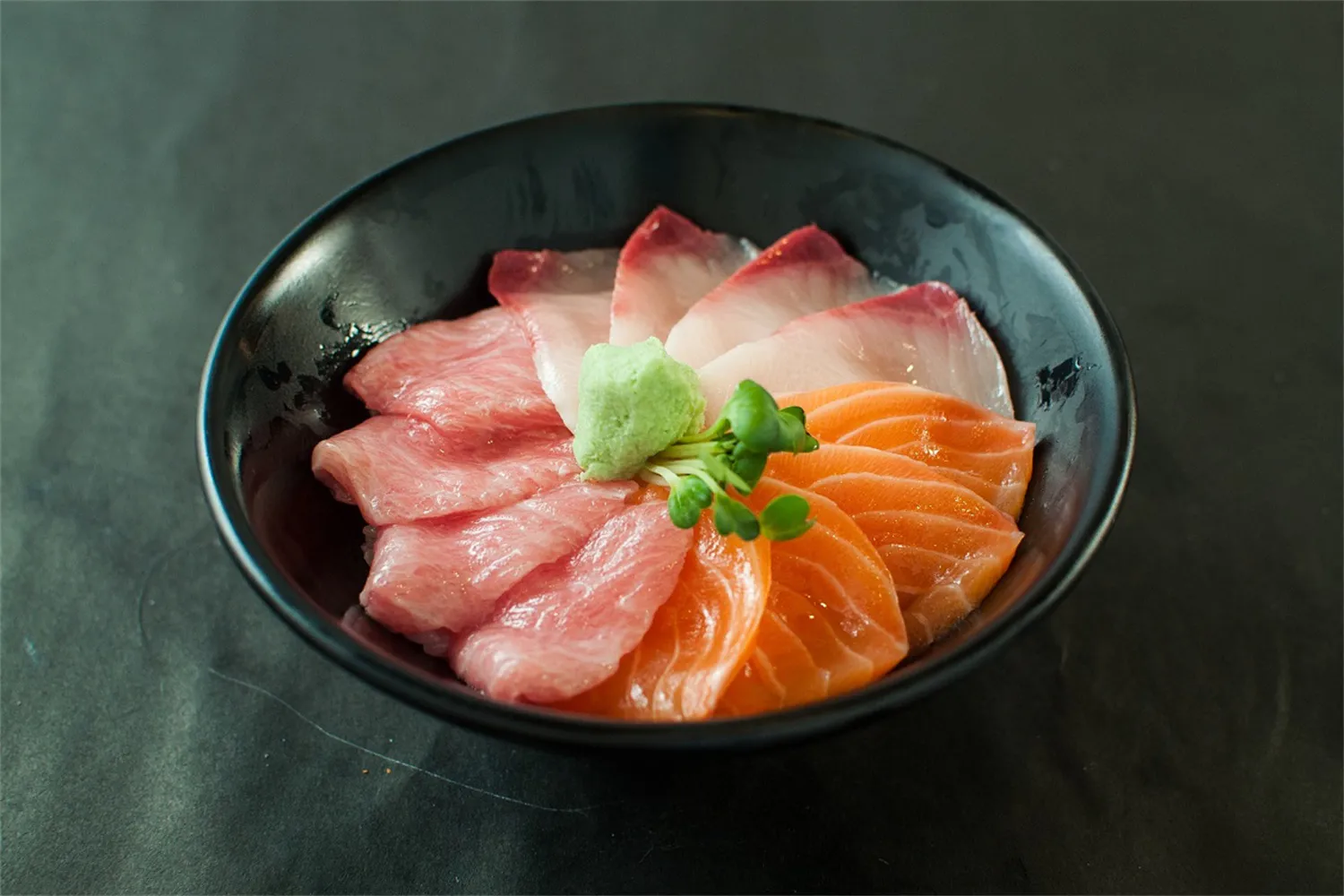 Assorted sashimi bowl with tuna, salmon, wasabi